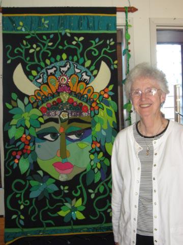 Rev. Dr. Ranck with Elizabeth Carefoot’s artwork “Gaia”
